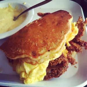 This is a fried softshell crab sandwiched between pancakes with scrambled eggs and other goodies. It's real, I promise.